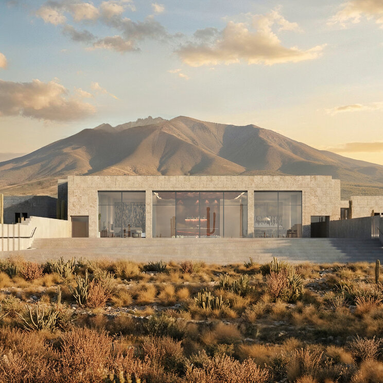 Außenansicht der Casa Gastón bei Uyuni mit moderner Architektur aus Naturstein, großen Glasfronten und Kakteen in karger Andenlandschaft vor Bergkulisse.