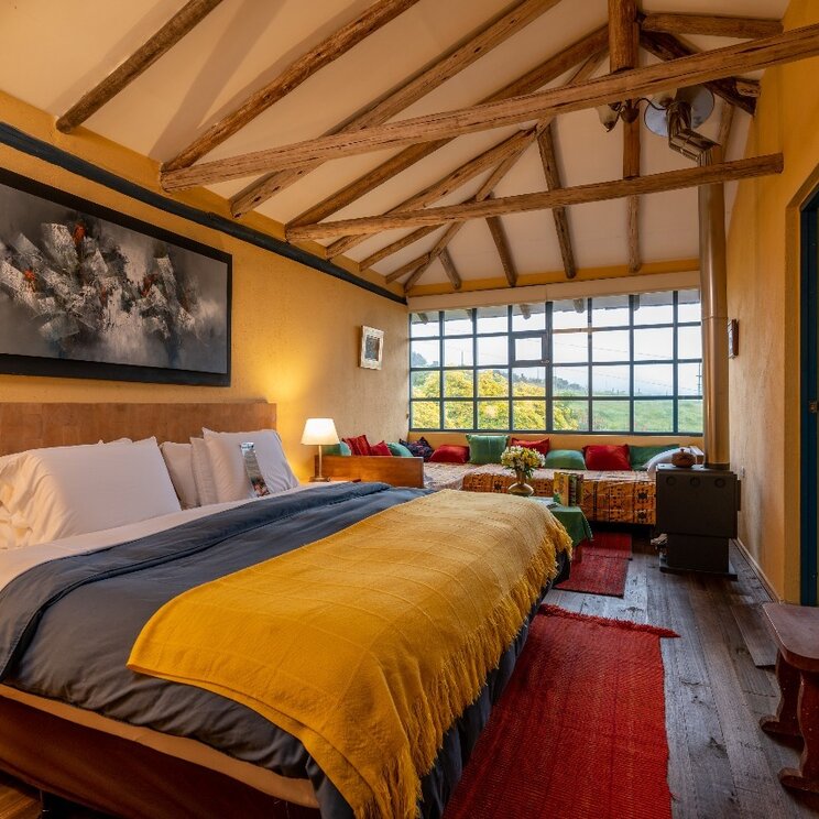Ein Dreibettzimmer im Hotel Hacienda El Porvenir