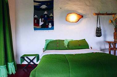 Zimmer mit grünem Interieur im Hotel Anacaona San Agustín