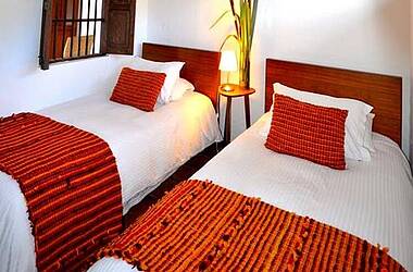 Zimmer mit getrennten Betten im Hotel Casa Terra, Villa de Leyva