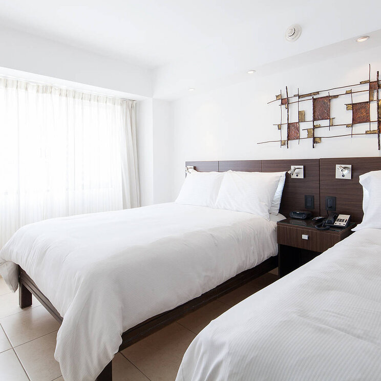 Superior-Zimmer im Hotel Presidente in San José, Costa Rica, mit zwei Einzelbetten und modernem Design.